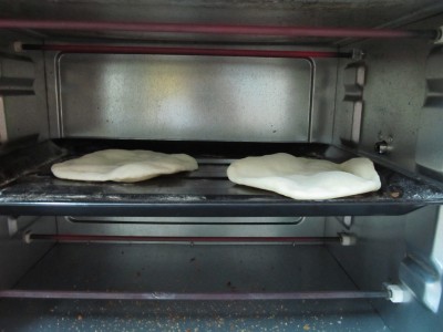 Pita breads in the oven